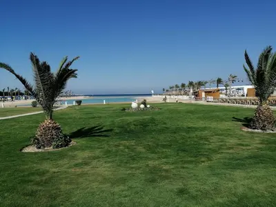 a park with palm trees on the beach at Private Room Hurghada for rent beach and pools included Not Valid for Locals in Hurghada