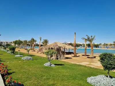 a park with palm trees and a beach at Private Room Hurghada for rent beach and pools included Not Valid for Locals in Hurghada