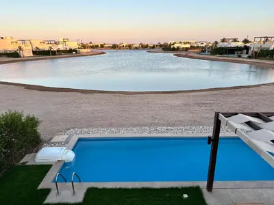 a swimming pool in the middle of a resort at El Gouna Cyan Villa with pool n lagoon by BFG Beit Fel Gouna in Hurghada