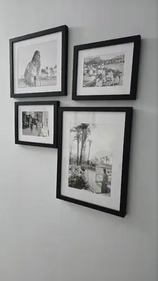 a group of pictures hanging on a wall at Florenza Khamsin Apartments in Hurghada