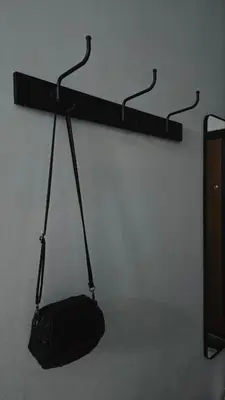 a black bag is hanging on a wall at Florenza Khamsin Apartments in Hurghada