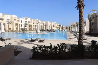 a swimming pool in the middle of a resort at Cozy Ground floor-Pool view - Mangroovy El Gouna in Hurghada