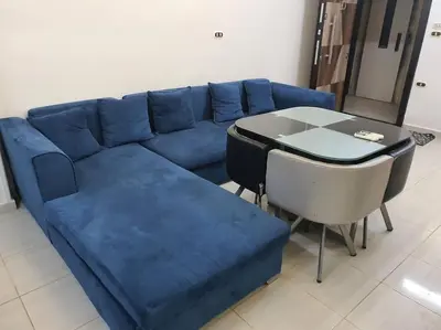 a blue couch and a table in a room at Hurghada city center in Hurghada