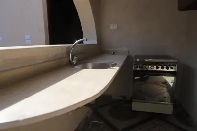 a kitchen with a sink and a stove at Happy house in Luxor