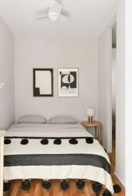 a bedroom with a bed with a black and white blanket at Sheraton Plaza Retreat in Hurghada