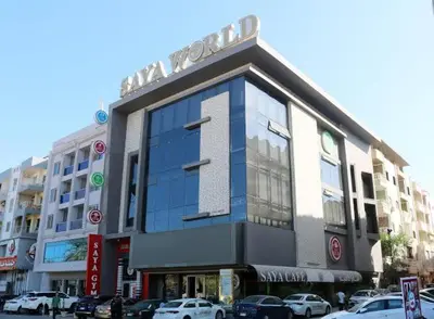 a building with a sign on the front of it at Sheraton Plaza Retreat in Hurghada