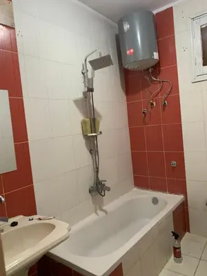 a bathroom with a shower and a bath tub at Welcome to LLL (Love Life Luxor) in Luxor