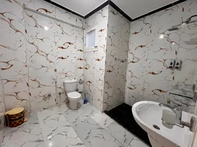 a bathroom with a toilet and a sink at Luxor Sun Villa in Luxor