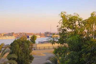 a view of a river with a city in the background at Pearl of Luxor on the Nile -Apartment in Luxor
