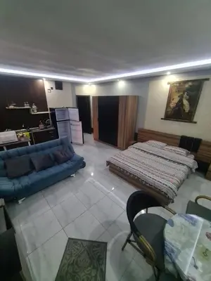 a living room with a bed and a couch at Horizon on Mamsha in Hurghada