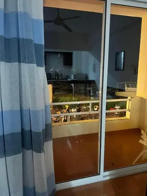 a view of a kitchen through a sliding glass door at Sea Life Hurghada Apartments in Hurghada