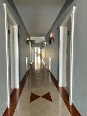 a hallway of a building with a tile floor at Sea Life Hurghada Apartments in Hurghada