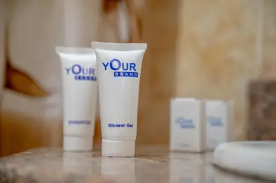 a group of three tubes of sunscreen sitting on a table at Sea Life Hurghada Apartments in Hurghada