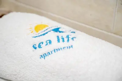 a towel with the words sea life participation on it at Sea Life Hurghada Apartments in Hurghada