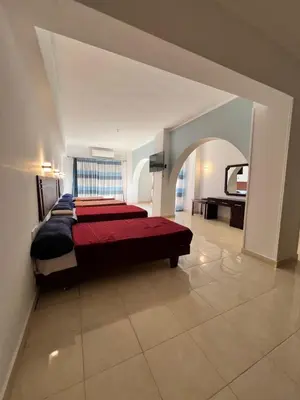 a bedroom with a large bed in a room at Sea Life Hurghada Apartments in Hurghada