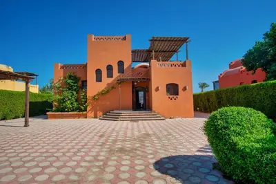 a building with a brick driveway in front of it at Wast golf Y 41 in Hurghada