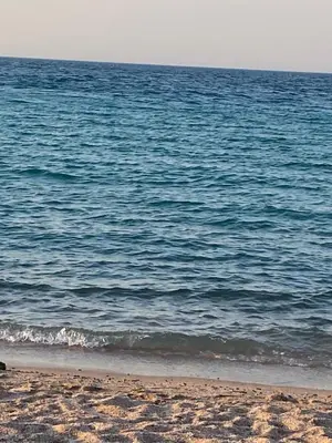 a view of the ocean from the beach at منتجع جوليانا بيتش ريزورت in Hurghada