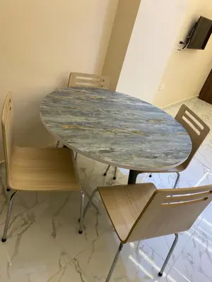 a table with two chairs and a marble table at منتجع جوليانا بيتش ريزورت in Hurghada