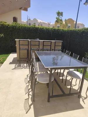 a table and chairs sitting on a patio at Villa Makadi Heights in Hurghada
