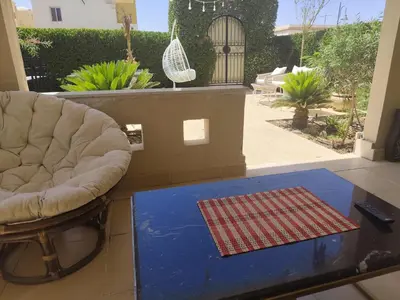 a living room with a couch and a table at Villa Makadi Heights in Hurghada