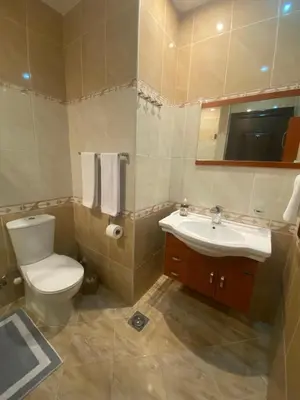 a bathroom with a toilet and a sink at Gravity Beach Apartment Non Egyptians only in Hurghada