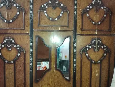 a wooden door with a mirror and a window at مدينة القصير in Quseir