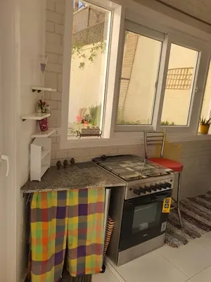 a kitchen with a stove and some windows at Hurghada Egypt Gable Al Haream Next-door to Hilton Plaza in Hurghada