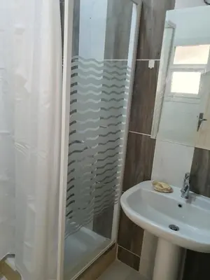 a bathroom with a shower and a sink at Hurghada Egypt Gable Al Haream Next-door to Hilton Plaza in Hurghada