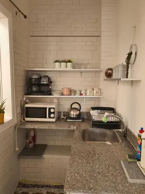 a kitchen with a sink and a microwave at Hurghada Egypt Gable Al Haream Next-door to Hilton Plaza in Hurghada