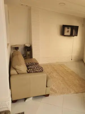 a living room with a couch and a rug at Hurghada Egypt Gable Al Haream Next-door to Hilton Plaza in Hurghada