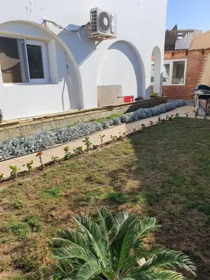 a house with a garden in front of it at Hurghada Egypt Gable Al Haream Next-door to Hilton Plaza in Hurghada