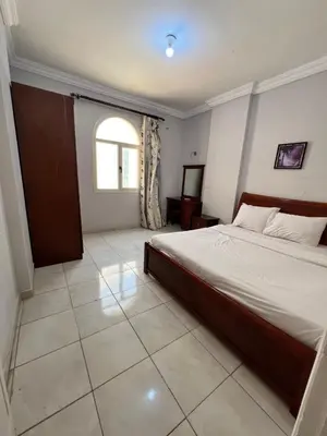 a bedroom with a large bed and a window at H&H Dream in Hurghada