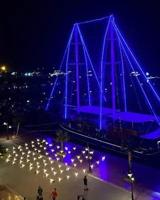 a building with blue lights on it at night at Comfort Marine in Hurghada