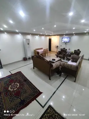 a living room with couches and a flat screen tv at شقة مفروشة رائعة كورنيش النيل برج الرياض in Naj‘ al ‘Amrāb
