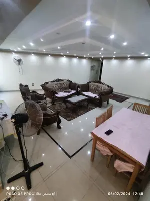 a living room with couches and a table in a room at شقة مفروشة رائعة كورنيش النيل برج الرياض in Naj‘ al ‘Amrāb