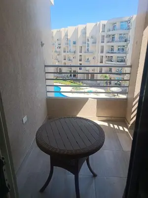 a table in a room with a view of a building at Princess resort flat no217 in Hurghada