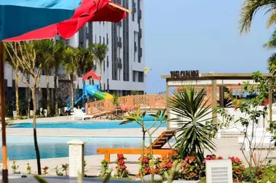 a swimming pool with a playground in a city at Fanadir Bay in Hurghada