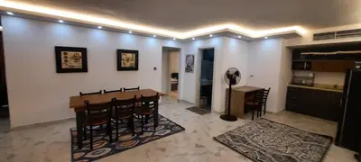 a dining room with a table and some chairs at Fanadir Bay in Hurghada