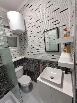 a bathroom with a toilet and a sink at Hurghada Flat in Hurghada