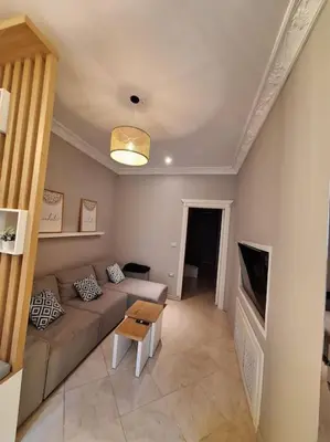 a living room with a couch and a table at Hurghada Flat in Hurghada