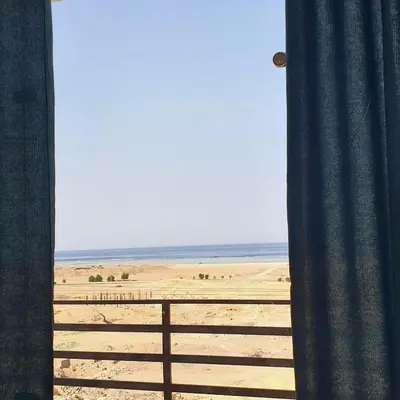 a view of the beach from a window at Lareen's apartment in Quseir