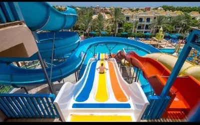 a slide in a water park with a water park at Chalet in mirage resort bay resort & aqua park in Hurghada