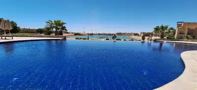 a large swimming pool with blue water at El Gouna Waterside E 1-Bedroom Ground Floor Sleeps 4 Persons in El Gouna