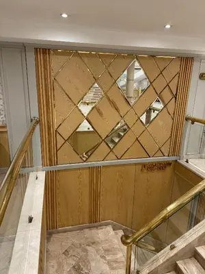 a room with a wooden wall with a glass window at Orient Tower Prestige Nile Cruise-Every Monday from Luxor for 04 & 07 Nights - Every Friday From Aswan for 03 Nights in Luxor