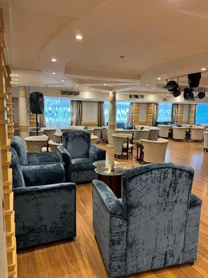 a large living room with couches and a television at Orient Tower Prestige Nile Cruise-Every Monday from Luxor for 04 & 07 Nights - Every Friday From Aswan for 03 Nights in Luxor