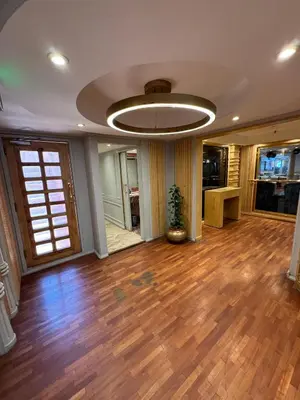 a living room with a hard wood floor and a ceiling at Orient Tower Prestige Nile Cruise-Every Monday from Luxor for 04 & 07 Nights - Every Friday From Aswan for 03 Nights in Luxor