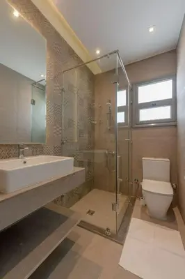 a bathroom with a sink and a toilet and a shower at Luxury Villa with private pool Sholan 2 in Hurghada