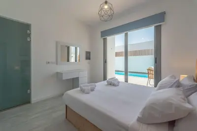 a bedroom with a large bed with a view of the ocean at Luxury Villa with private pool Sholan 2 in Hurghada