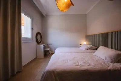 a bedroom with two beds and a window at Luxury One Bedroom Apartment with Sea view in SomaBay in Hurghada