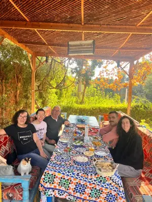 a group of people sitting around a table at Villa Barba Luxor in Luxor